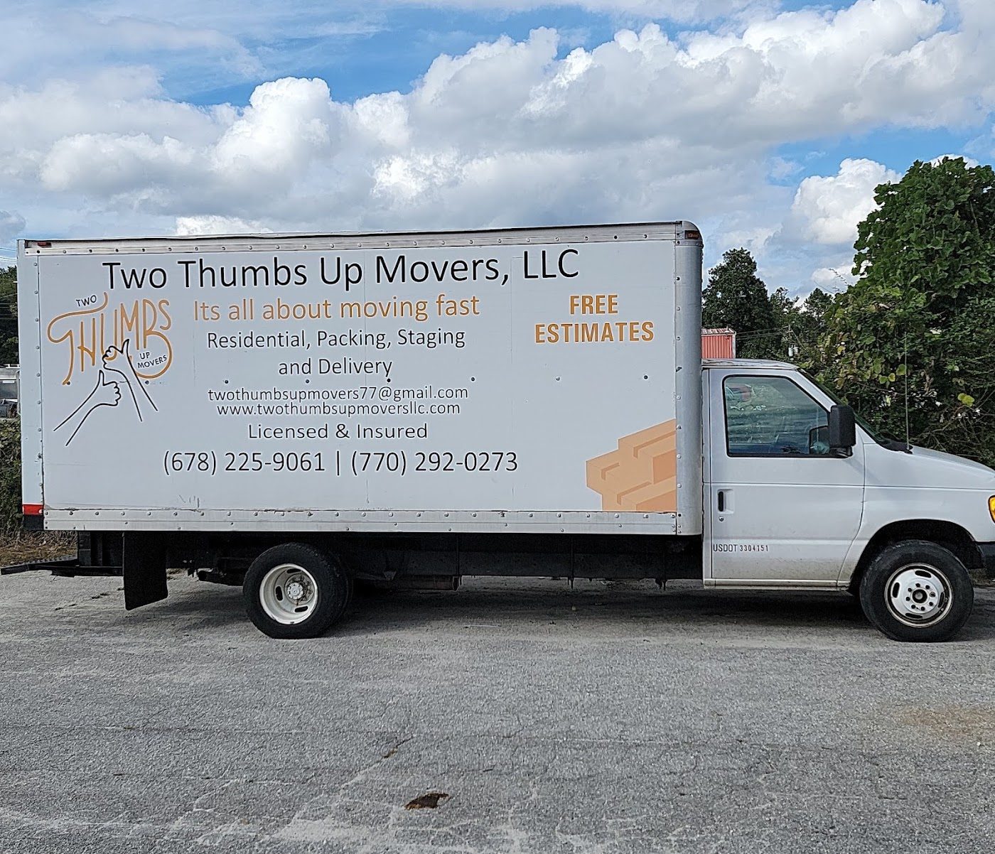 Two Thumbs Up Movers truck
